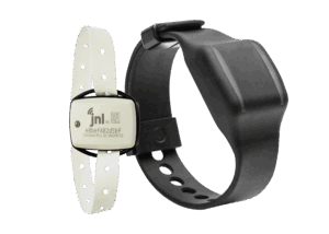 On the left, a thin white  ankle band holds a small wander tag device with the JNL logo. On the right, a smartwatch-like device for the wrist is pictured, also containing a wander tag.